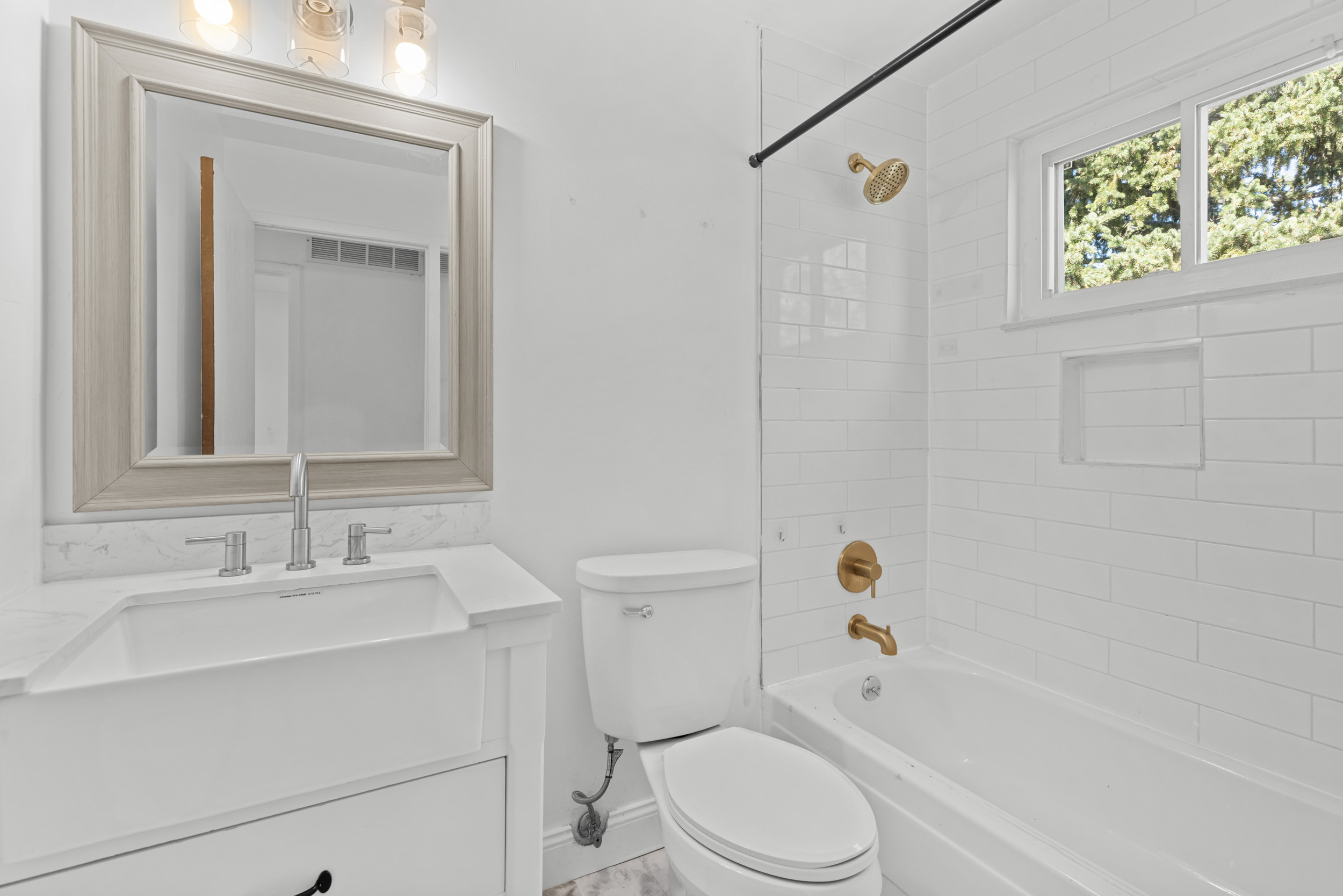 Remodeled upper bath with gold fixtures